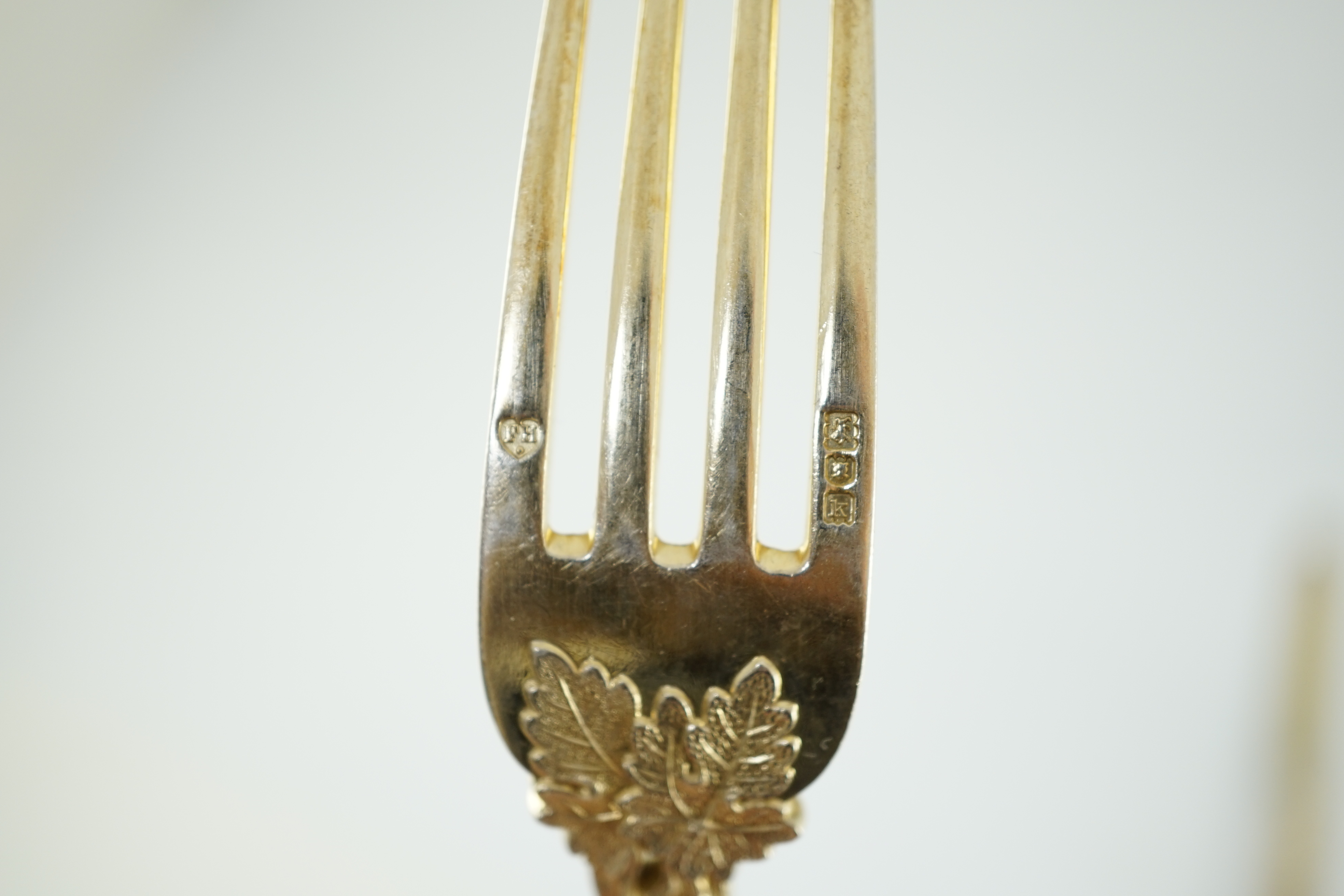 A Victorian and later matched silver gilt part canteen of dessert cutlery by Francis Higgins II & III